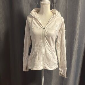 Athletes white zip up jacket with hood.